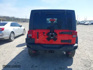 2015 Jeep Wrangler Unlimited Rubicon Hard Rock with VIN 1C4HJWFG9FL525556, listed as a IAAI auction lot 41973576 with 246,949 mi miles. Bid and sale history available at carsss.com. Image 16.
