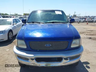 1997 Ford F-150 XL with VIN 1FTDX18W4VKC95711, listed as a IAAI auction lot 42197302 with 287,660 mi miles and . Bid and sale history available at DreamBid. Image 6.