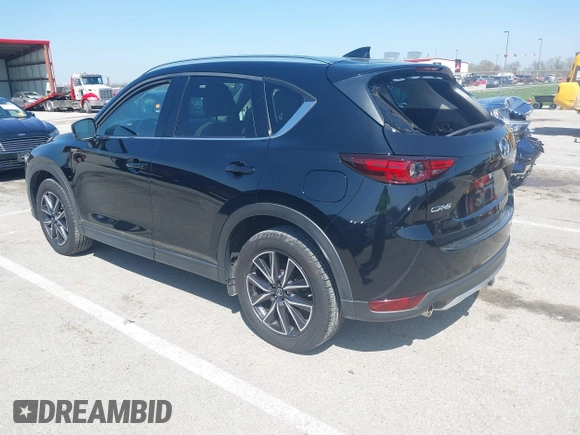 2018 Mazda CX-5 Grand Touring with VIN JM3KFADM2J1324547, listed as a IAAI auction lot 41947497 with 66,254 mi miles. Bid and sale history available at carsss.com. Image 3.