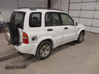 2000 Suzuki Grand Vitara JLX z VIN JS3TD62V1Y4119064, wystawiony jako IAAI lot #40845963 z przebiegiem 339 219 mil mil oraz . Historia ofert i sprzedaży dostępna na DreamBid. Obrazek 4.