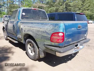 2000 Ford F-150 XL with VIN 1FTZF0722YKB38958, listed as a IAAI auction lot 42050827 with 235,315 mi miles. Bid and sale history available at carsss.com. Image 3.
