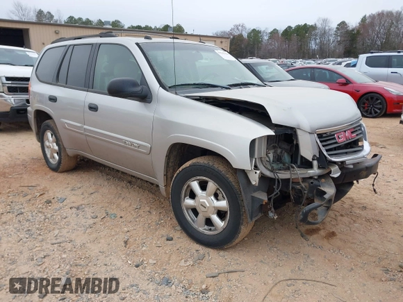 2005 GMC Envoy SLT with VIN 1GKDT13S452263166, listed as a IAAI auction lot 41543466 with 166,999 mi miles. Bid and sale history available at carsss.com. Image 1.