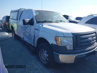 2010 Ford F-150 XL with VIN 1FTEX1E88AKE76184, listed as a IAAI auction lot 41715520 with 157,449 mi miles. Bid and sale history available at carsss.com. Image 1.