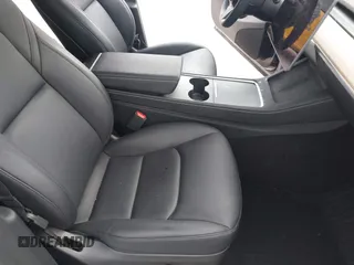 2024 Tesla Model Y with VIN 7SAYGDED3RF002246, listed as a IAAI auction lot 41566184 with 10,316 mi miles and . Bid and sale history available at DreamBid. Image 5.