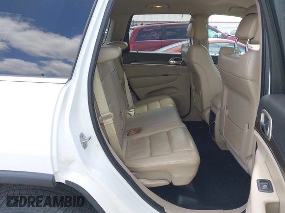 2014 Jeep Grand Cherokee Limited z VIN 1C4RJFBG9EC122590, wystawiony jako IAAI lot #42037881 z przebiegiem 137 270 mil mil oraz . Historia ofert i sprzedaży dostępna na DreamBid. Obrazek 8.