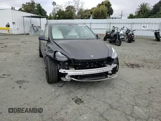 2024 Tesla Model Y Performance with VIN 7SAYGDEF7RF093054, listed as a Copart auction lot 50747985 with 26,907 mi miles and Salvage Title. Bid and sale history available at DreamBid. Image 10.