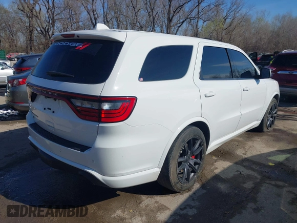 2018 Dodge Durango SRT with VIN 1C4SDJGJXJC395094, listed as a IAAI auction lot 41857351 with 90,106 mi miles and . Bid and sale history available at DreamBid. Image 4.