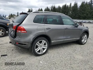 2012 Volkswagen Touareg Sport with VIN WVGFK9BP4CD001860, listed as a Copart auction lot 55090375 with 153,456 mi miles and Salvage title. Bid and sale history available at DreamBid. Image 3.