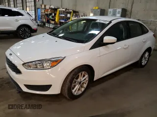 2018 Ford Focus SE with VIN 1FADP3F21JL211284, listed as a Copart auction lot 79227884 with 49,187 mi miles and Salvage title. Bid and sale history available at DreamBid. Image 1.
