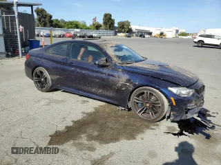 2015 BMW M4 with VIN WBS3R9C50FK335084, listed as a Copart auction lot 61962965 with 142,157 mi miles and Salvage title. Bid and sale history available at DreamBid. Image 4.