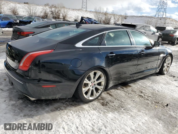 2015 Jaguar XJ Portfolio z VIN SAJWJ2GD4F8V79582, wystawiony jako Copart lot #42121395 z przebiegiem 65 017 mil mil oraz Szkoda całkowita • Salvage title. Historia ofert i sprzedaży dostępna na DreamBid. Obrazek 3.
