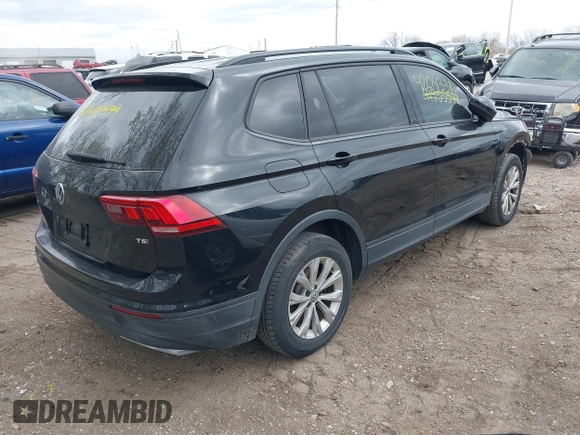 2018 Volkswagen Tiguan S with VIN 3VV1B7AX1JM076071, listed as a IAAI auction lot 42043311 with 107,883 mi miles and . Bid and sale history available at DreamBid. Image 4.