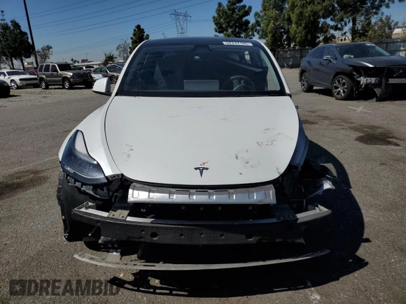 2022 Tesla Model Y Long Range with VIN 7SAYGDEE8NF551850, listed as a Copart auction lot 52747195 with 62,340 mi miles and Salvage Title. Bid and sale history available at carsss.com. Image 5.