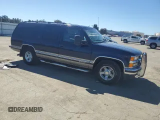 1999 Chevrolet Suburban with VIN 1GNEC16R1XJ394144, listed as a Copart auction lot 50418185 with 173,037 mi miles and Salvage title. Bid and sale history available at DreamBid. Image 4.