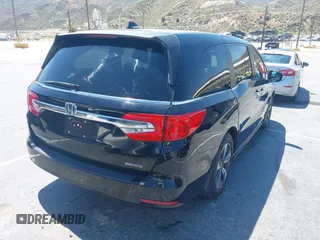 2018 Honda Odyssey Touring with VIN 5FNRL6H8XJB026247, listed as a IAAI auction lot 42298961 with 66,571 mi miles and . Bid and sale history available at DreamBid. Image 4.