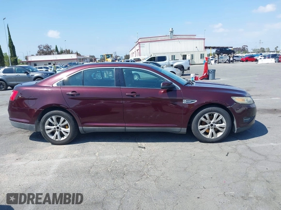 2011 Ford Taurus SEL with VIN 1FAHP2EW8BG137937, listed as a IAAI auction lot 42107586 with 143,525 mi miles. Bid and sale history available at carsss.com. Image 14.