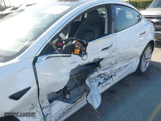 2018 Tesla Model 3 Long Range Battery with VIN 5YJ3E1EA0JF008351, listed as a IAAI auction lot 41129459 with 36,518 mi miles. Bid and sale history available at carsss.com. Image 6.