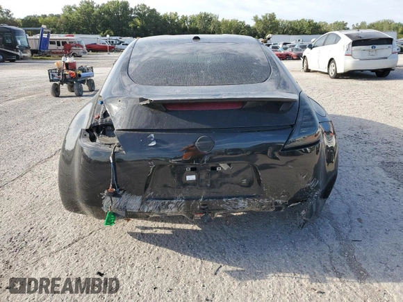 2014 Nissan 370Z z VIN JN1AZ4EH9EM636239, wystawiony jako Copart lot #69833264 z przebiegiem 110 802 mil mil oraz Szkoda całkowita • Salvage title. Historia ofert i sprzedaży dostępna na DreamBid. Obrazek 6.