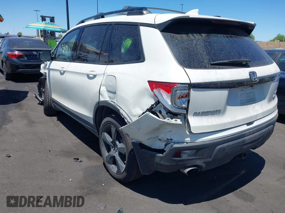2019 Honda Passport Elite z VIN 5FNYF8H05KB009575, wystawiony jako IAAI lot #42804678 z przebiegiem 70 468 mil mil oraz . Historia ofert i sprzedaży dostępna na DreamBid. Obrazek 3.