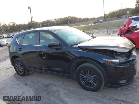 2019 Mazda CX-5 Sport with VIN JM3KFABMXK0693540, listed as a IAAI auction lot 41523569 with 57,895 mi miles and . Bid and sale history available at DreamBid. Image 13.