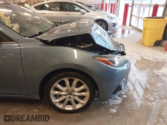 2014 Mazda 3 S Grand Touring with VIN JM1BM1W31E1182703, listed as a IAAI auction lot 41470742 with 123,956 mi miles and . Bid and sale history available at DreamBid. Image 17.