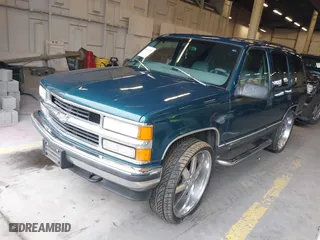 1997 Chevrolet Tahoe with VIN 1GNEK13R8VJ411512, listed as a IAAI auction lot 41583085 with 239,481 mi miles. Bid and sale history available at carsss.com. Image 2.