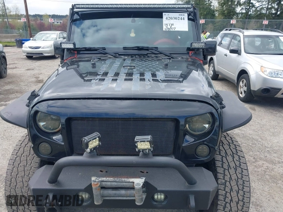 2014 Jeep Wrangler Unlimited Sahara with VIN 1C4BJWEG6EL107526, listed as a IAAI auction lot 42030244 with 69,077 mi miles. Bid and sale history available at carsss.com. Image 6.