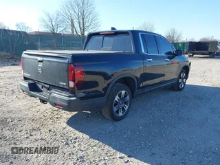 2019 Honda Ridgeline RTL-E with VIN 5FPYK3F7XKB033652, listed as a IAAI auction lot 41751421 with 96,774 mi miles and . Bid and sale history available at DreamBid. Image 4.