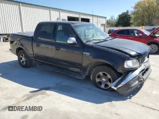 2003 Ford F-150 XLT with VIN 1FTRW07653KB60478, listed as a Copart auction lot 50491255 with 298,616 mi miles and Salvage Title. Bid and sale history available at carsss.com. Image 4.