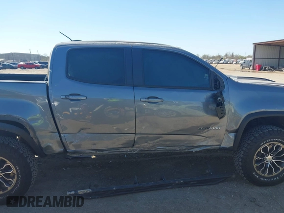 2018 Chevrolet Colorado 4WD ZR2 z VIN 1GCGTEEN0J1115894, wystawiony jako IAAI lot #41774860 z przebiegiem 71 698 mil mil oraz . Historia ofert i sprzedaży dostępna na DreamBid. Obrazek 14.
