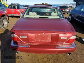 1999 Jaguar XJ with VIN SAJPX1849XC857869, listed as a Copart auction lot 83773914 with 172,496 mi miles and Clean title. Bid and sale history available at DreamBid. Image 6.