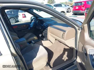 2001 Jeep Grand Cherokee Laredo with VIN 1J4GW48S11C519210, listed as a IAAI auction lot 42093631 with 211,024 mi miles. Bid and sale history available at carsss.com. Image 5.