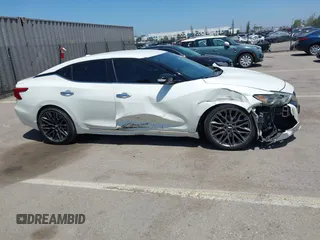 2016 Nissan Maxima SV with VIN 1N4AA6AP6GC903638, listed as a IAAI auction lot 42180421 with 124,586 mi miles and . Bid and sale history available at DreamBid. Image 13.