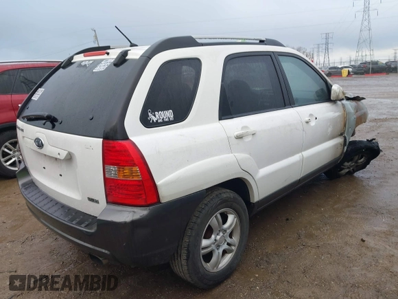 2006 Kia Sportage LX z VIN KNDJE723267254864, wystawiony jako IAAI lot #40875961 z przebiegiem 295 412 mil mil oraz . Historia ofert i sprzedaży dostępna na DreamBid. Obrazek 4.