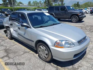 1997 Honda Civic LX z VIN 2HGEJ6670VH570062, wystawiony jako IAAI lot #42218254 z przebiegiem 86 555 mil mil oraz . Historia ofert i sprzedaży dostępna na DreamBid. Obrazek 1.
