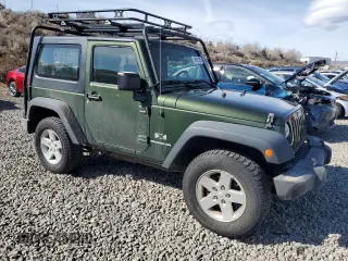 2009 Jeep Wrangler X with VIN 1J4FA24169L707695, listed as a Copart auction lot 49861955 with 89,807 mi miles and Salvage Title. Bid and sale history available at DreamBid. Image 4.