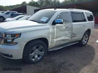 2015 Chevrolet Tahoe LTZ with VIN 1GNSCCKC2FR140524, listed as a IAAI auction lot 41592878 with 284,785 mi miles. Bid and sale history available at carsss.com. Image 2.