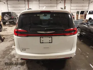 2021 Chrysler Pacifica Touring L with VIN 2C4RC1BG3MR504293, listed as a IAAI auction lot 41728608 with 70,487 mi miles and . Bid and sale history available at DreamBid. Image 16.