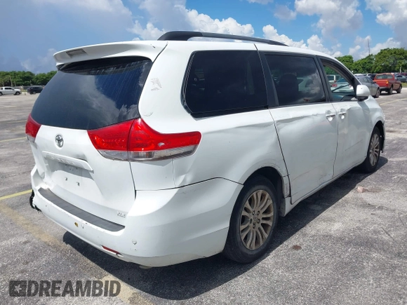 2014 Toyota Sienna XLE with VIN 5TDYK3DC4ES414728, listed as a IAAI auction lot 42588916 with 291,007 mi miles and . Bid and sale history available at DreamBid. Image 4.