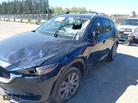 2020 Mazda CX-5 Grand Touring with VIN JM3KFBDM7L0724005, listed as a IAAI auction lot 42034658 with 90,631 mi miles. Bid and sale history available at carsss.com. Image 6.