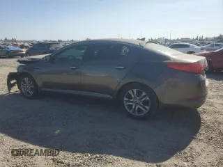 2013 Kia Optima EX z VIN 5XXGN4A77DG199443, wystawiony jako Copart lot #62406035 z przebiegiem 171 081 mil mil oraz Szkoda całkowita • Salvage title. Historia ofert i sprzedaży dostępna na DreamBid. Obrazek 2.