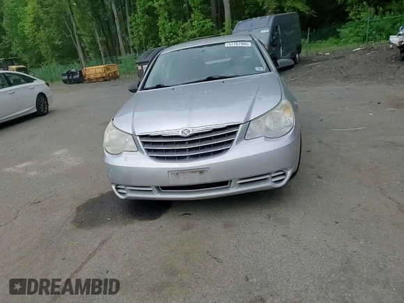2010 Chrysler Sebring Touring z VIN 1C3CC4FB3AN203543, wystawiony jako Copart lot #57767985 z przebiegiem 152 951 mil mil oraz Szkoda całkowita • Salvage title. Historia ofert i sprzedaży dostępna na DreamBid. Obrazek 13.