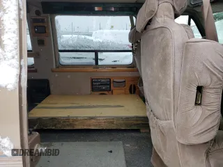 1995 GMC Vandura z VIN 1GDEG25KXSF550311, wystawiony jako Copart lot #78730594 z przebiegiem 149 663 mil mil oraz Szkody całkowita. Historia ofert i sprzedaży dostępna na DreamBid. Obrazek 11.