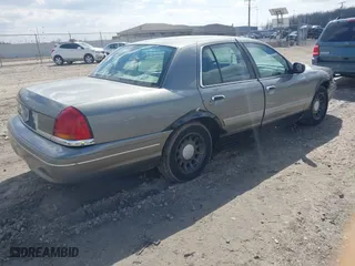 2001 Ford Crown Victoria LX with VIN 2FAFP74W01X102534, listed as a IAAI auction lot 42017605 with 160,063 mi miles. Bid and sale history available at carsss.com. Image 4.