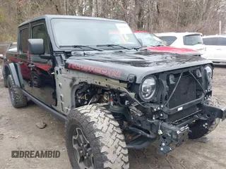 2021 Jeep Gladiator Rubicon z VIN 1C6JJTBG8ML524215, wystawiony jako IAAI lot #41829990 z przebiegiem 62 942 mil mil oraz . Historia ofert i sprzedaży dostępna na DreamBid. Obrazek 1.