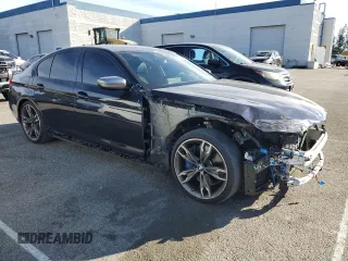 2020 BMW 5 Series M550i xDrive with VIN WBAJS7C06LBN96210, listed as a Copart auction lot 46769365 with 39,710 mi miles and Salvage title. Bid and sale history available at DreamBid. Image 4.