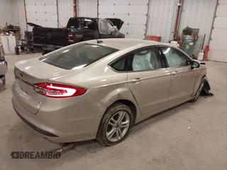 2018 Ford Fusion SE z VIN 3FA6P0HD2JR201693, wystawiony jako IAAI lot #42012709 z przebiegiem 110 857 mil mil oraz . Historia ofert i sprzedaży dostępna na DreamBid. Obrazek 4.