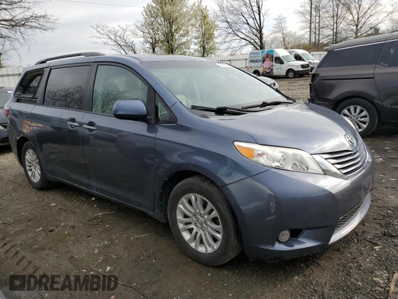 2015 Toyota Sienna XLE with VIN 5TDYK3DC4FS643475, listed as a Copart auction lot 52697405 with 153,808 mi miles and Salvage Title. Bid and sale history available at DreamBid. Image 4.