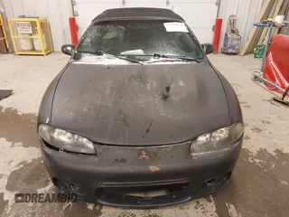 1999 Mitsubishi Eclipse GS with VIN 4A3AX35G3XE061702, listed as a IAAI auction lot 41323151 with 155,941 mi miles. Bid and sale history available at carsss.com. Image 6.