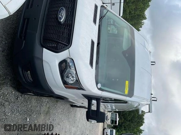 2023 Ford Transit Cargo with VIN 1FTBR1X81PKA75434, listed as a IAAI auction lot 42742887 with 5,111 mi miles and . Bid and sale history available at DreamBid. Image 14.